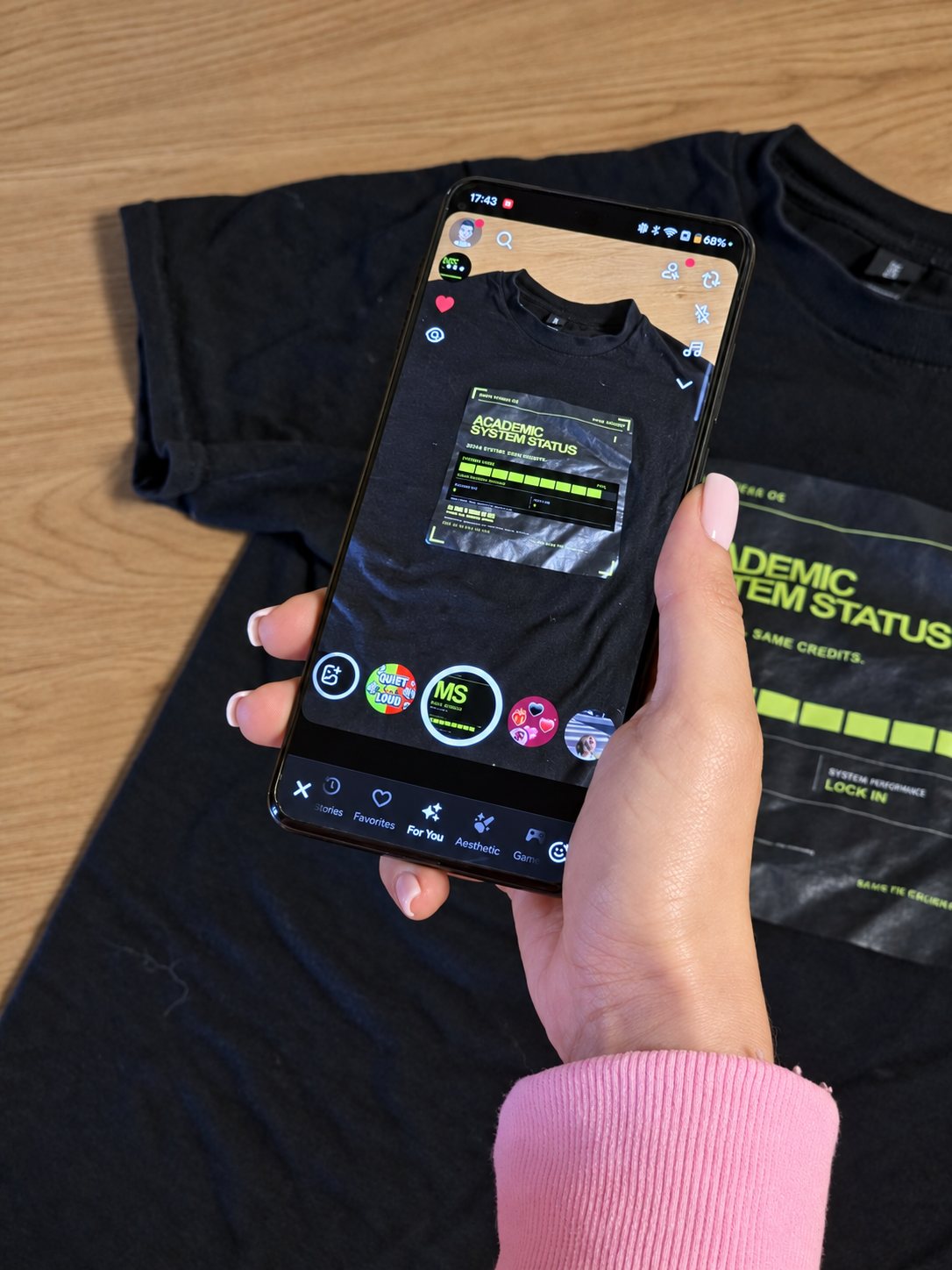 A phone scanning the real More Stress tee in Snapchat